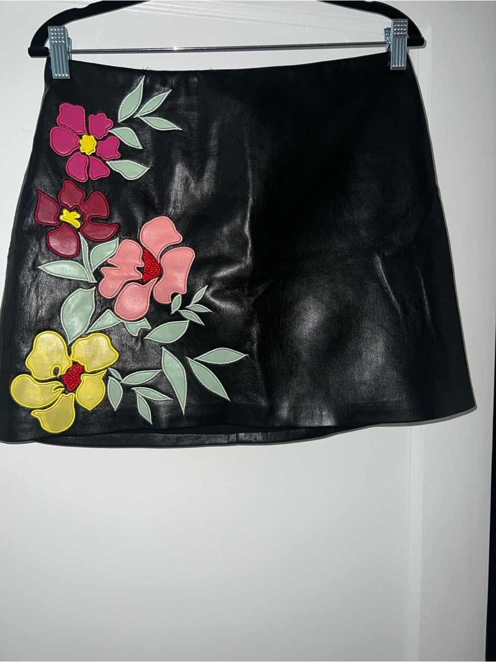 Alice + Olivia Black Faux Leather Mini Skirt with Floral Appliqués